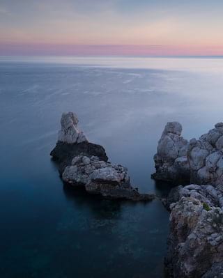 Large rock formations by the sea at daybreak
