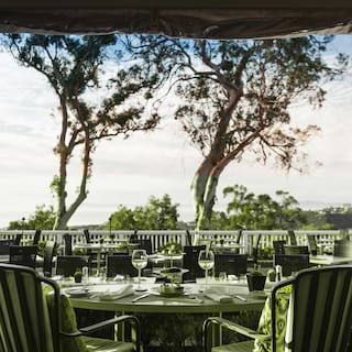 View of a restaurant terrace looking out to the Pacific Ocean