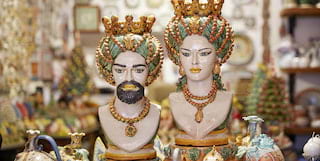 An exotic couple of figurines in a colourful collection of ceramic art in Taormina